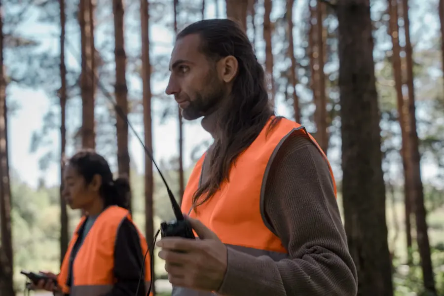 Event crew in hi-vis on radios at an outdoor event.